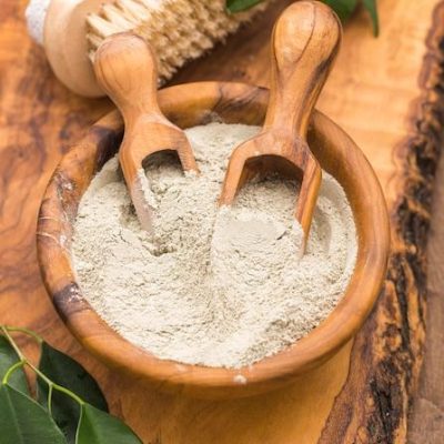 Natural Fuller's Earth (Multani Mitti) in a wooden bowl with scoops